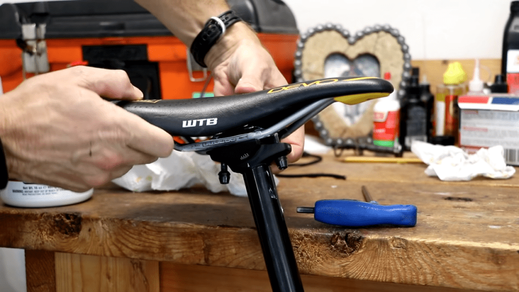 Position the saddle rails on the clamp