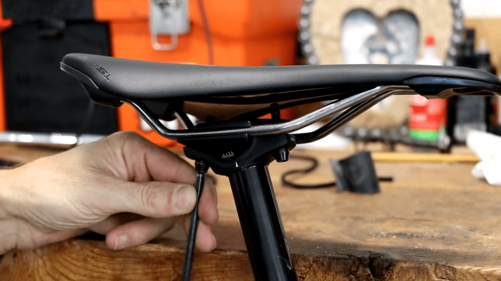 Unscrew the seat bolts